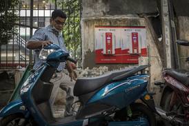 Charging an electric scooter in New Delhi. Consumers in India are increasingly becoming aware of the benefits of electric vehicles. Bloomberg