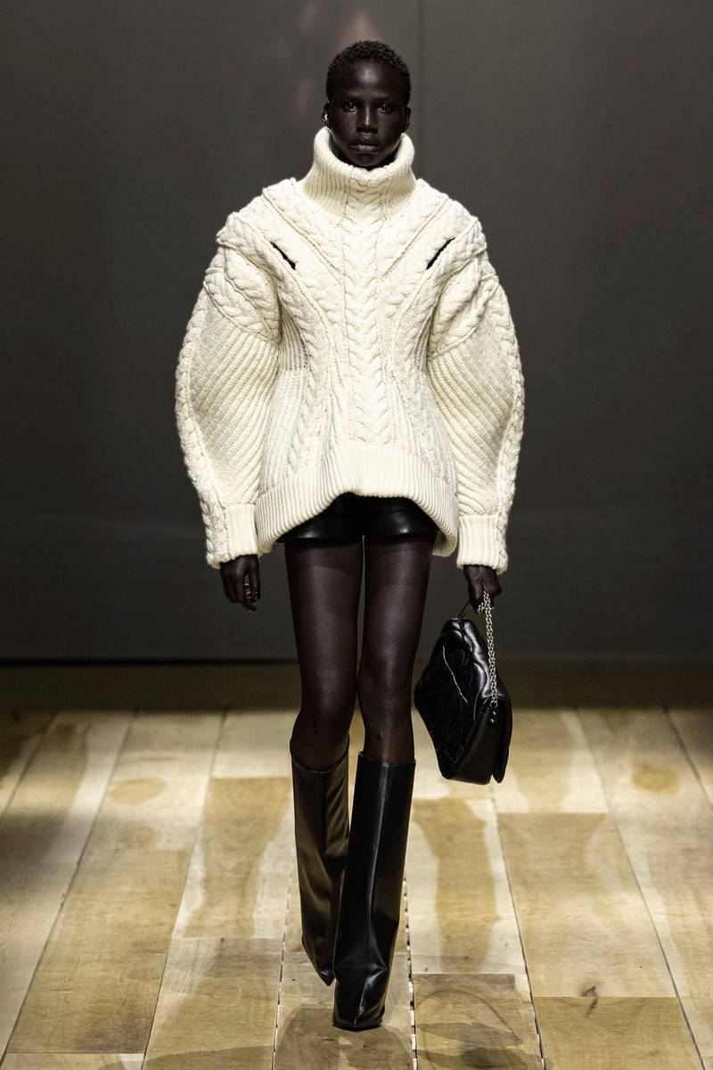 A knitted top and leather mini skirt by Alexander McQueen autumn/winter 2023. Photo: Alexander McQueen
