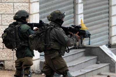 Israeli soldiers on March 19 on patrol in the town of Huwara, in the occupied West Bank, after a shooting in the area. AFP