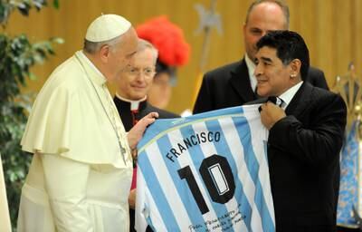 Pope Francis meets football legend Diego Maradona during an audience in Rome in September 2014. Getty Images