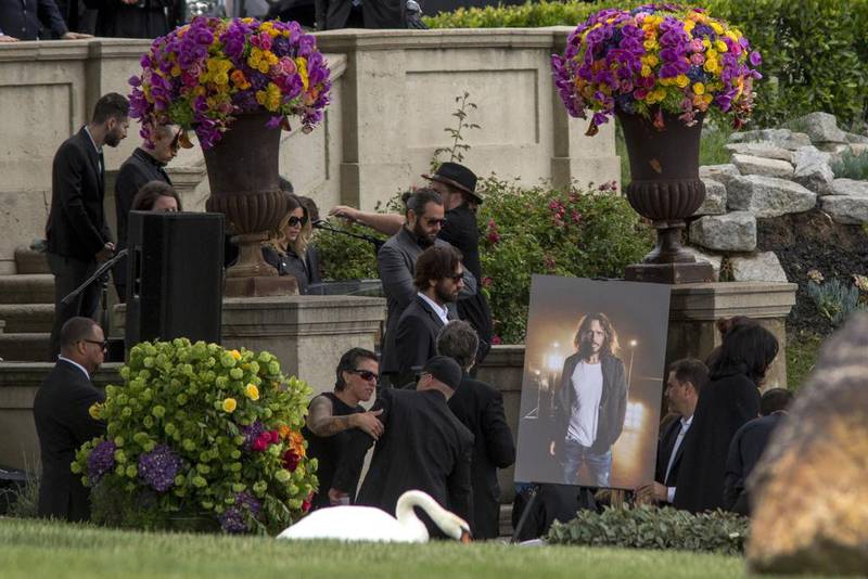 A portrait of Chris Cornell is moved into place for funeral services for Soundgarden frontman Chris Cornell at Hollywood Forever Cemetery on May 26, 2017 in Hollywood, California. David McNew/Getty Images/AFP



