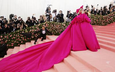 epa08431348 Lady Gaga wears a spectacular pink evening gown as she arrives for the 2019 Met Gala in New York, USA, 06 May 2019 (reissued 19 May 2020). Pink became fashionable as a luxurious color worn by both sexes in the mid 1700s. By the time men moved to darker hues, women adopted pink and it became the girls' color. In the 1960s high fashion and celebrities embraced pink. A significant change took place when the color became a symbol for women's and LGBTQ rights in the 1970s and, from 1990 on, also the symbolic color for the struggle against breast cancer. Subsequently, pink is now recognized as a color of protest, femininity, joy, energy and affirmation.  EPA-EFE/JUSTIN LANE  ATTENTION: This Image is part of a PHOTO SET