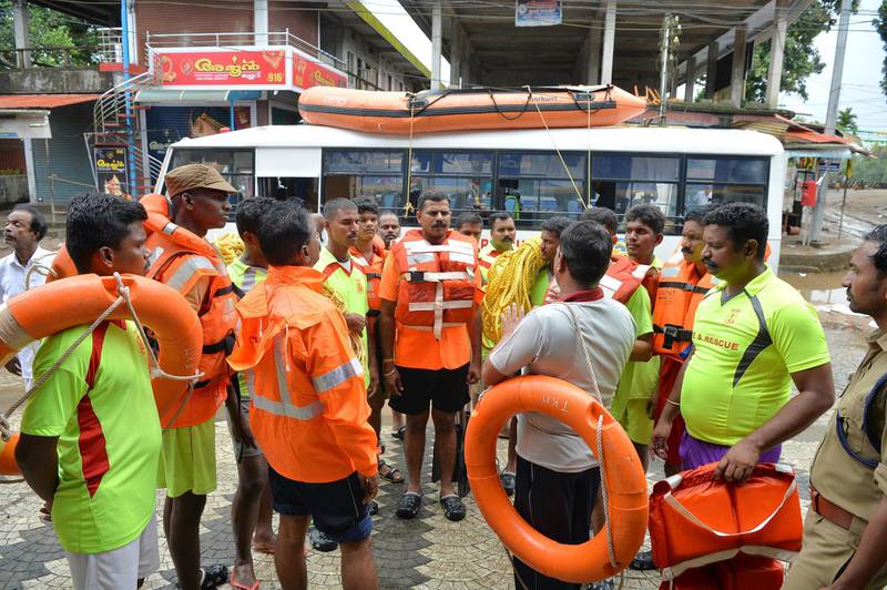 Kerala and Tamil Nadu Fire Force personnel plan a rescue mission in Annamanada village in Thrissur District, Kerala. AFP