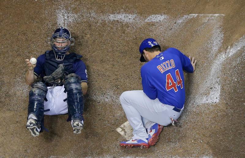 Milwaukee Brewers catcher Erik Kratz holds onto the ball after tagging out Chicago Cubs' Anthony Rizzo during the fifth inning of a baseball in Milwaukee. Morry Gash/AP Photo