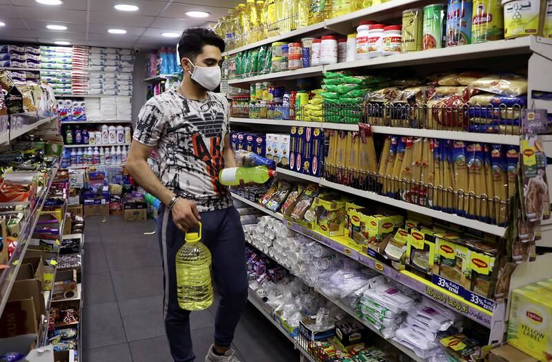 A customer wearing a protective face mask shops inside a grocery store in Beirut, Lebanon December 7, 2020. Picture taken December 7, 2020. REUTERS/Mohamed Azakir