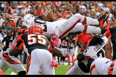 Cleveland Browns running back Montario Hardest, center, leaps for a touchdown against the Cincinnati Bengals in Cleveland, Ohio. Tony Dejak / AP Photo