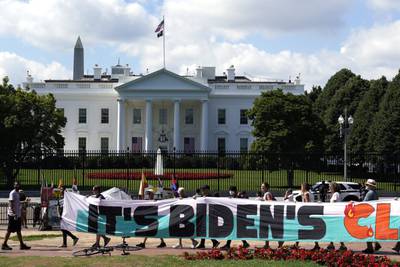 Climate activists rally in front of the White House to demand the declaration of a climate emergency and a move away from fossil fuels. AP