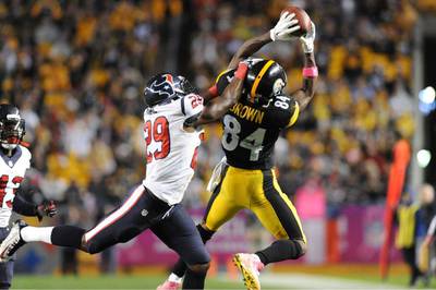 Pittsburgh Steelers wide receiver Antonio Brown, right, makes a catch past Houston Texans defensive back Andre Hal, left, during Pittsburgh's win over Houston in the NFL on Monday night. Don Wright / AP / October 20, 2014