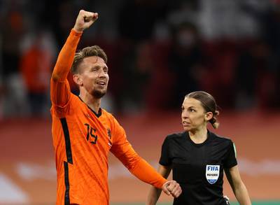 Luuk de Jong of Netherlands celebrates after scoring their team's second goal as Referee Stephanie Frappart looks on. Getty