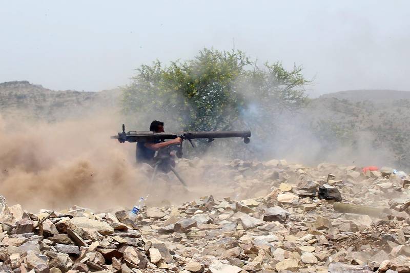 A Yemeni pro-government fighter fires a recoilless rocket launcher weapon as Saudi and Emirati supported forces take over Huthi bases on the frontline of Kirsh between the province of Taez and Lahj, southwestern Yemen, on July 1, 2018. The United Arab Emirates on Sunday announced it had halted the offensive it is backing against Huthi rebels in Yemen's port city of Hodeida to give a chance to UN diplomatic efforts.
 / AFP / Saleh Al-OBEIDI
