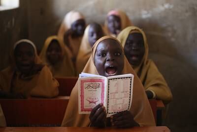 A girl recites Islamic texts at a school in Maiduguri, north-eastern Nigeria, where there is optimism that life is slowly returning back to normal after a 12-year terrorist insurgency. EPA