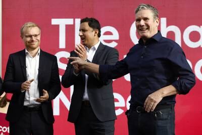 Labour leader Keir Starmer celebrates winning Rutherglen and Hamilton West with victorious candidate Michael Shanks, left, and Scottish Labour leader Anas Sarwar. Getty Images