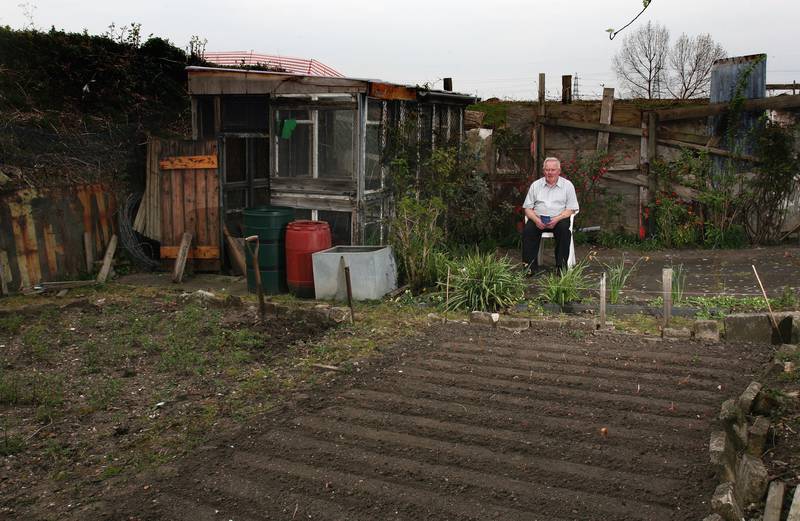 Tommy Doolan takes a break from working on his plot on the Manor Garden Allotments in 2007. The allotments were to be removed to build a footpath to the Olympic Stadium for the 2012 games.