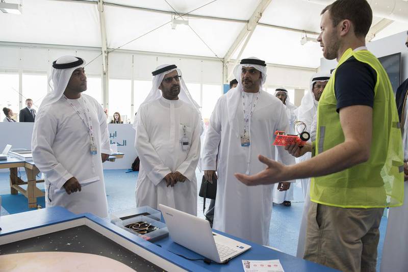 Dr Ali Al Nuaimi, Director General of the Abu Dhabi Education Council, leads officials on a tour of the Abu Dhabi Science Festival grounds at Umm Al Emarat Park in Abu Dhabi. Vidhyaa for The National