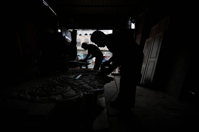 Yemeni labourers work at a wood shop on International Labour Day in the country's capital, Sanaa. International Labour Day, or May Day, is observed annually on 1 May around the world and celebrates workers, their rights, achievements and contributions to society. EPA