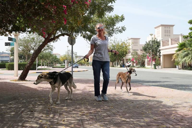 Rebecca Rees with her dogs at Jumeirah Village Triangle. She describes it as 'the perfect location', with supermarkets and shops within the community and great facilities for walking the dogs.