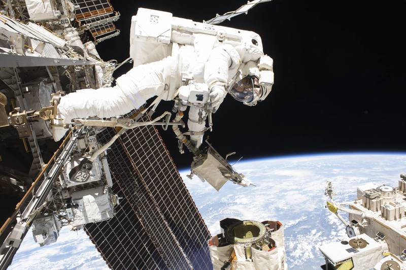 In this photo provided by Nasa, astronaut Mark Vande Hei performs a spacewalk to lubricate the Canadarm2 on October  10, 2017. AP