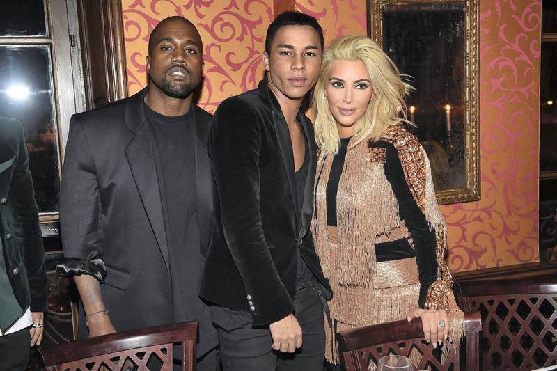 PARIS, FRANCE - MARCH 05:  Kanye West, Olivier Rousteing and Kim Kardashian attend the Balmain Aftershow Dinner as part of the Paris Fashion Week Womenswear Fall/Winter 2015/2016  on March 5, 2015 in Paris, France.  (Photo by Jacopo Raule/Getty Images For Balmain)