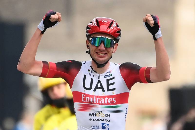 UAE Team Emirates US rider Brandon McNulty celebrates as he crosses the finish line to win the 5th stage of the 80th Paris - Nice cycling race, 189 km between Saint-Just-Saint-Rambert and Saint-Sauveur-de-Montagut, on March 10, 2022.  (Photo by FRANCK FIFE  /  AFP)
