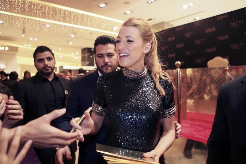 Blake Lively signs autographs for fans at The Dubai Mall while promoting the new Gucci Première fragrance. Sarah Dea / The National


