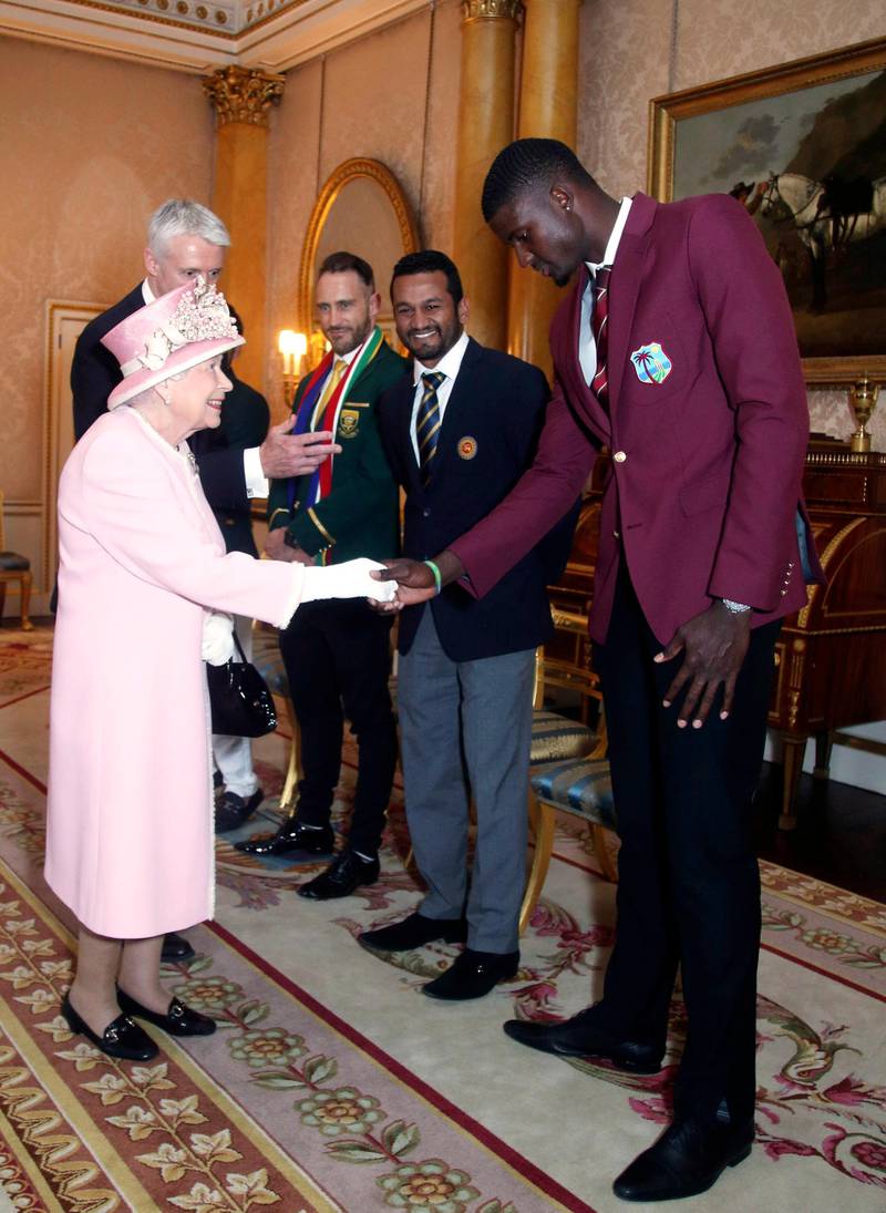The Queen meets West Indies cricket captain Jason Holder. AP Photo