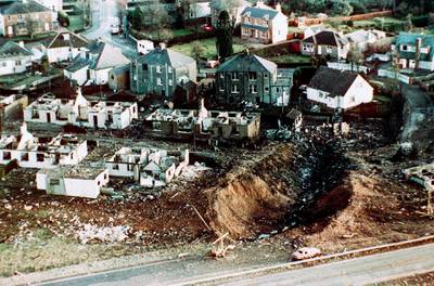 Wrecked houses and a crater in the ground in the village of Lockerbie, Scotland, after the bombing of the Pan Am 103.
