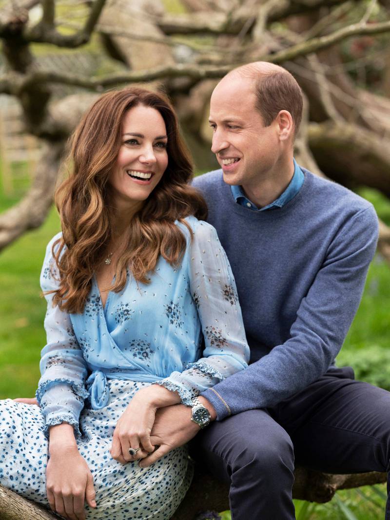 The two new images, taken at Kensington Palace this week by photographer Chris Floyd, capture William and Kate smiling and in a relaxed mood. AP Photo