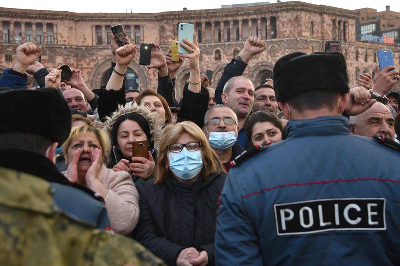 Supporters of Prime Minister Nikol Pashinyan react as they listen to his speech at Republic Square in downtown Yerevan. Armenian Prime Minister Nikol Pashinyan called on the army to fulfil its duty and obey the people and elected officials, after the military called for him to resign. AFP