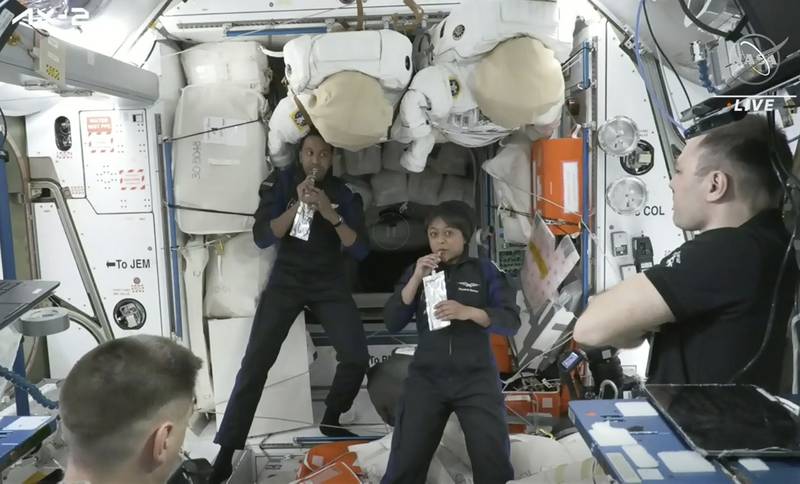 Mr Al Qarni and Ms Barnawi rehydrate alongside two cosmonauts on the ISS. AP