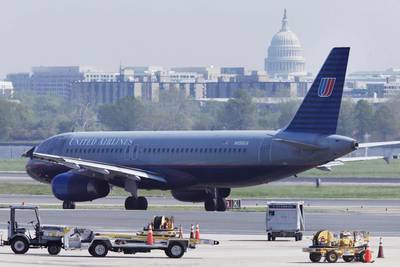 A United Airlines plane taxis on the runway of Washington's Ronald Reagan Washington National Airport. Manuel Balce Ceneta / AP Photo