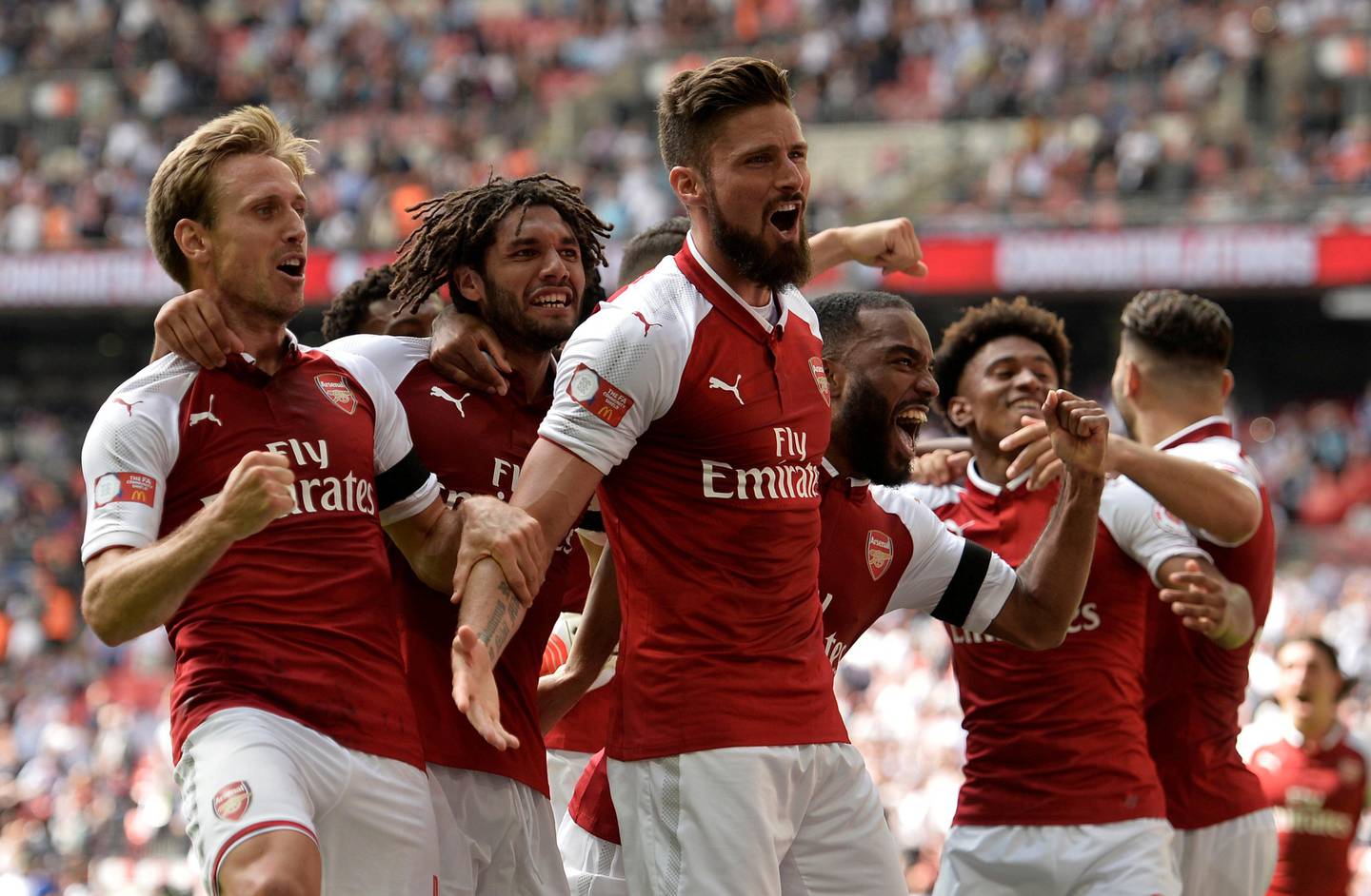 Soccer Football - Chelsea vs Arsenal - FA Community Shield - London, Britain - August 6, 2017   Arsenal's Olivier Giroud celebrates with teammates after scoring the winning penalty during the penalty shootout    REUTERS/Hannah McKay     TPX IMAGES OF THE DAY