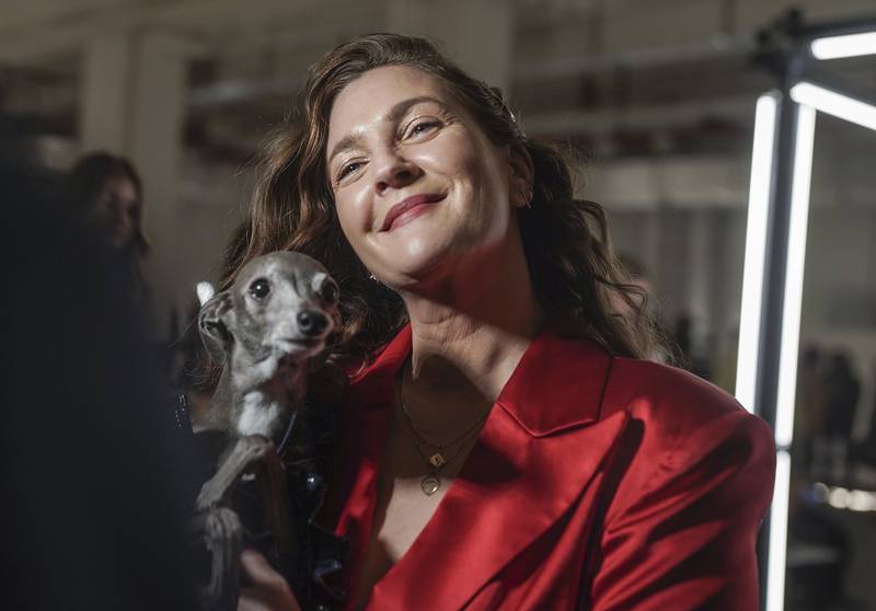 Drew Barrymore holds Tika the Iggy during an interview before viewing Christian Siriano's autumn/winter 2022 fashion collection at New York Fashion Week on Saturday. AP