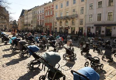 In this picture taken on March 18, 109 empty prams and baby baskets are seen outside the Lviv city council during an action to highlight the number of children killed in Russia's invasion of Ukraine. AFP