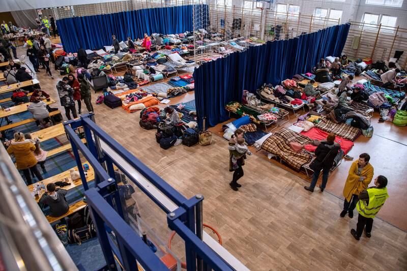 Refugees from Ukraine arrive at an assistance point organised in the sports hall of a primary school in Lubycza Krolewska in Poland. EPA