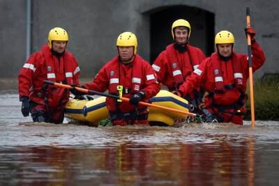 Emergency services rescuing people from the floods. Getty Images