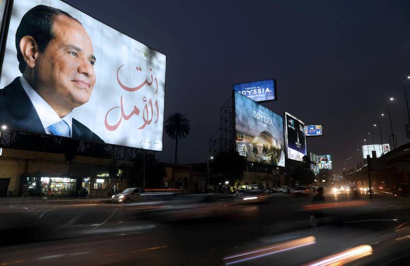 FILE PHOTO: A Cairo street sign showing Egypt's President Abdel Fattah al-Sisi ahead of the presidential election, March 25, 2018.  REUTERS/Ammar Awad/File Photo