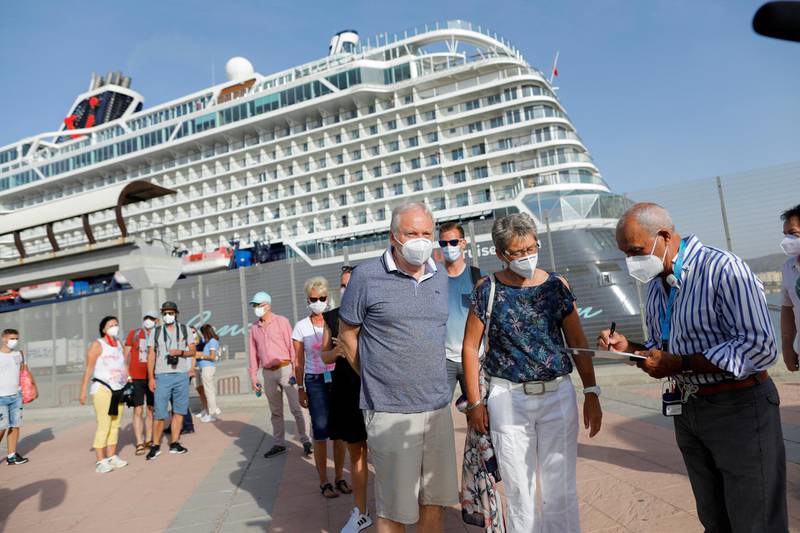 German tourists disembark for sightseeing from the cruise ship 'Mein Schiff 2', the first cruise ship carrying tourists to arrive on Spain's mainland since June 2020. Reuters
