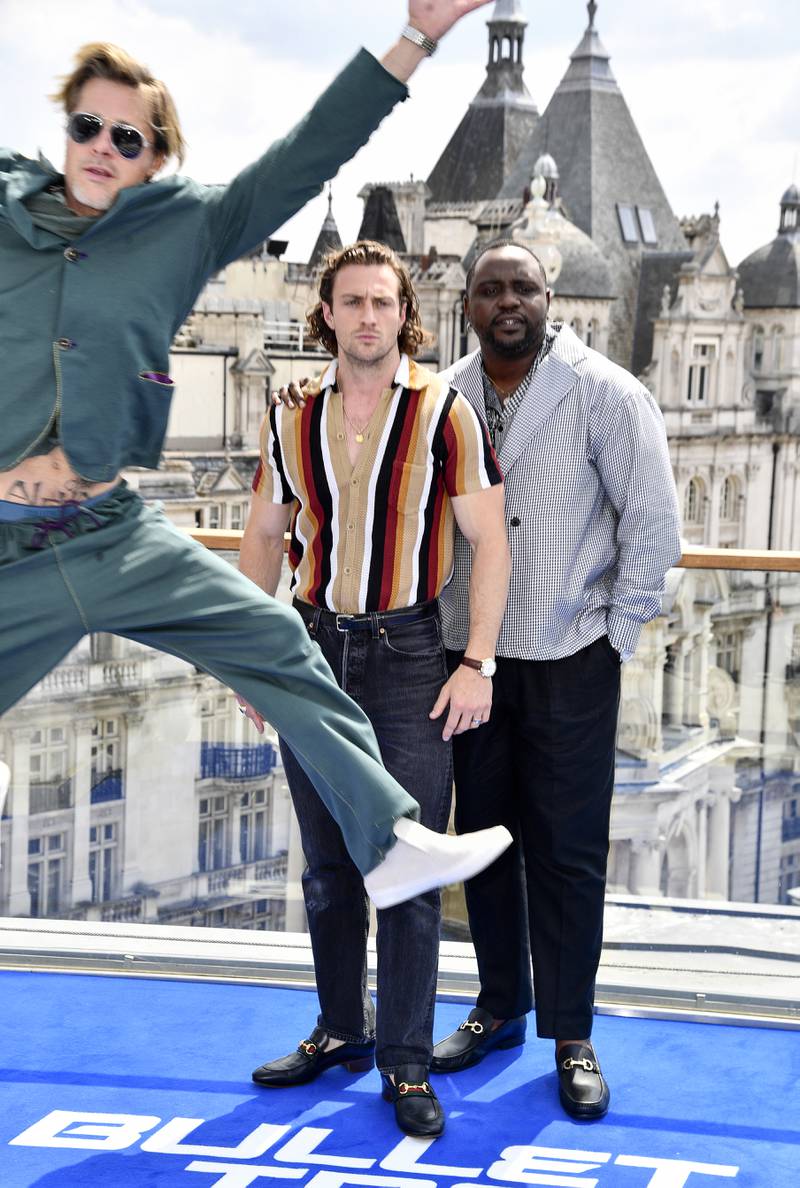 Hollywood star Brad Pitt photo-bombed his own photo-call on Wednesday in London, as fellow actors Aaron Taylor-Johnson and Brian Tyree Henry posed to promote the new 'Bullet Train' movie. Getty Images