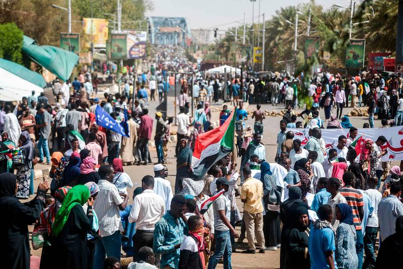 Sudanese demonstrators gather for a rally.  AFP