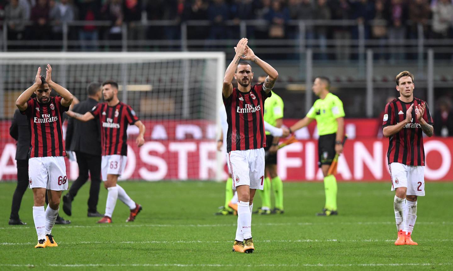 Soccer Football - Serie A - AC Milan vs AS Roma - San Siro, Milan, Italy - October 1, 2017   AC Milan's Leonardo Bonucci, Ricardo Rodriguez and Lucas Biglia applaud the fans at the end of the match    REUTERS/Alberto Lingria