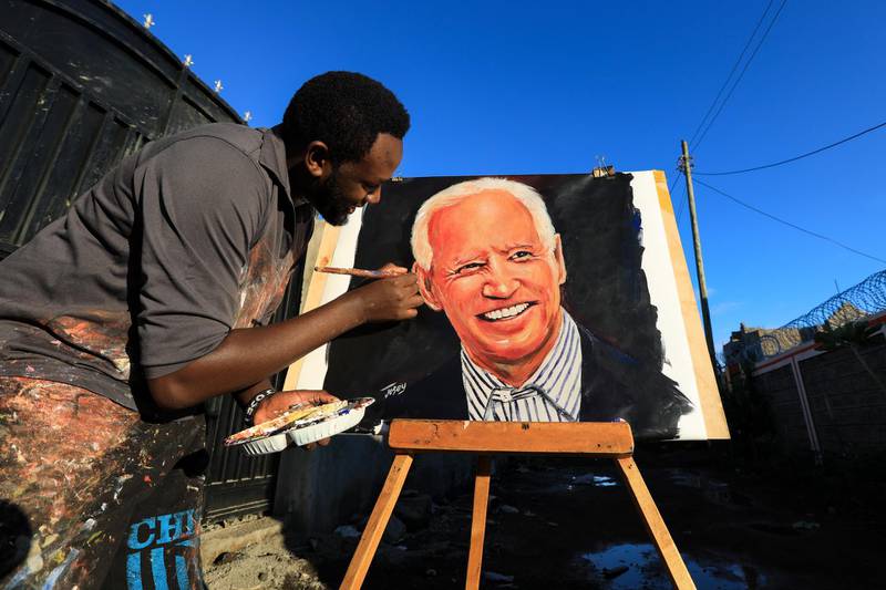 epa08810362 Kenyan artist Joseph Njoroge, also known by his artist name 'Josey Arts,' paints a portrait of US President-elect Joe Biden in Ruiru, Kiambu, Kenya, 09 November 2020. Biden defeated incumbent US President Donald J. Trump in the US 2020 Presidential Election.  EPA/Daniel Irungu