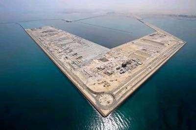 Companies such as those at Abu Dhabi's Khalifa Industrial Zone, and around the world, exist in order to ensure efficient markets but they shouldn't get too big. Courtesy Abu Dhabi Ports Company