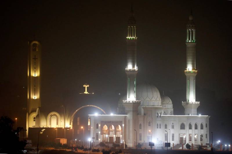Minarets of a mosque and a cross on top of a church are seen during cold weather before Sunday's Coptic Christmas Eve Mass in Cairo, Egypt January 5, 2019. REUTERS/Amr Abdallah Dalsh