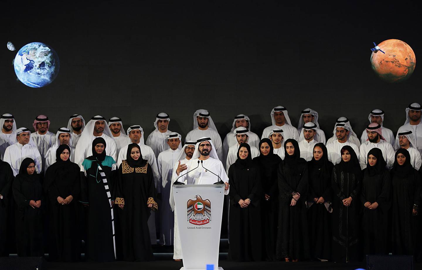 Dubai ruler Sheikh Mohammed bin Rashid Al Maktoum, center, announces a United Arab Emirates' Mars mission named "Hope" ��� or "al-Amal" in Arabic ��� which is scheduled be launched in 2020, during a ceremony in Dubai, UAE, Wednesday, May 6, 2015. It would be the Arab world's first space probe to Mars and will take seven to nine months to reach the red planet, arriving in 2021. Emirati scientists hope the unmanned probe will provide a deeper understanding of the Martian atmosphere, and expect it to remain in orbit until at least 2023. (AP Photo/Kamran Jebreili)