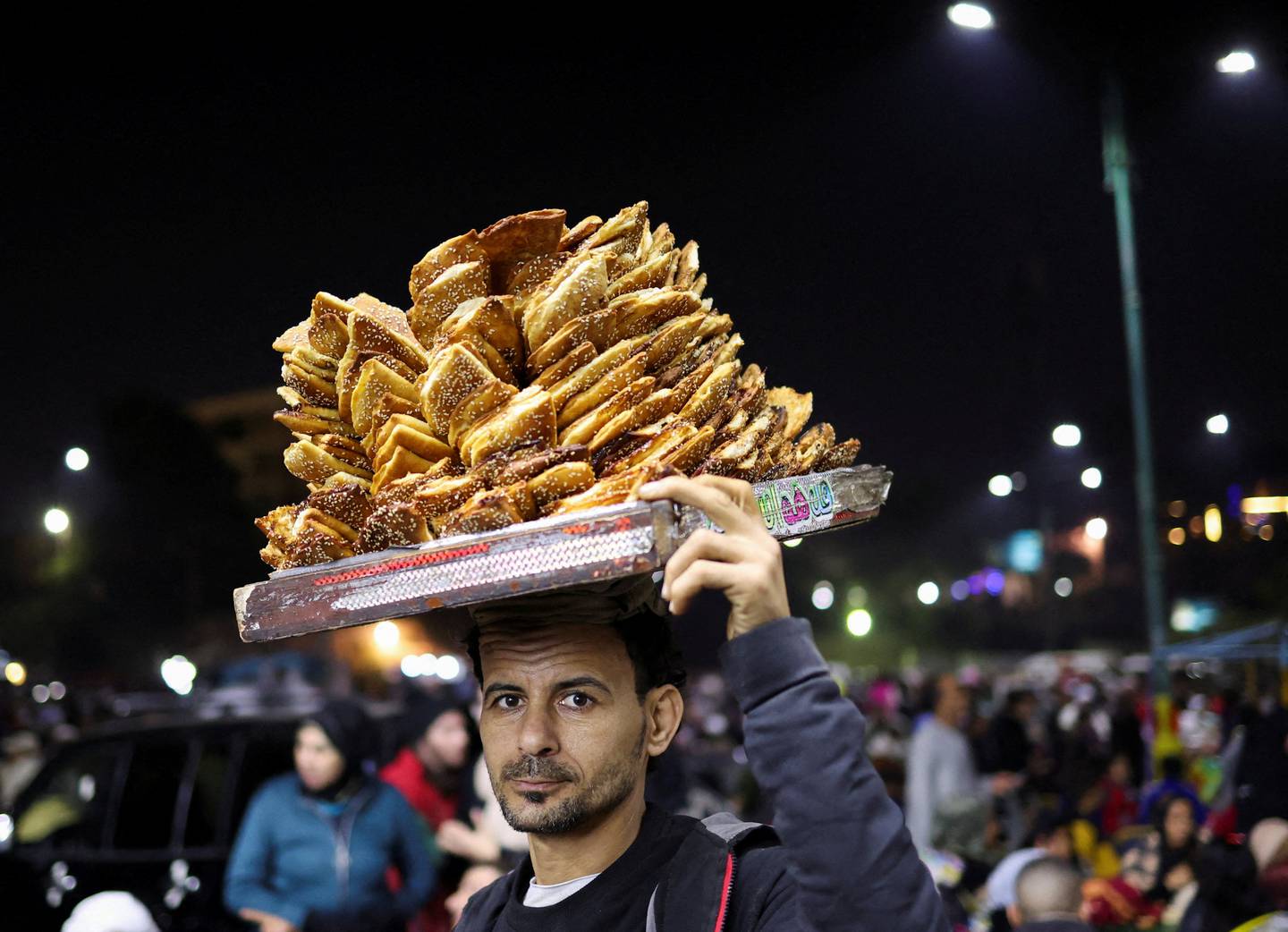 An Egyptian street vendor during a religious ceremony in Cairo. Reuters