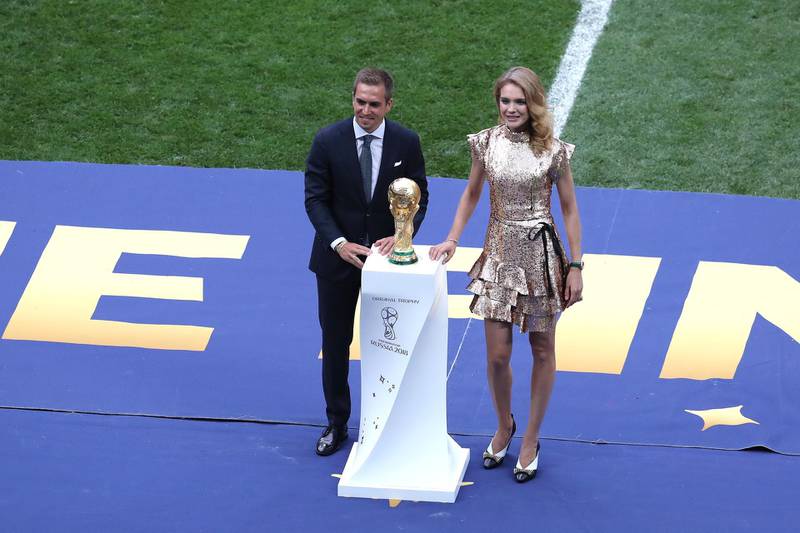 Former German international footballer, Philipp Lahm and philanthropist Natalia Vodianova present the 2018 FIFA World Cup Original Trophy ahead of the final. Getty Images