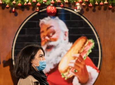 Shoppers at a Christmas market in London on the final Saturday before Christmas. PA