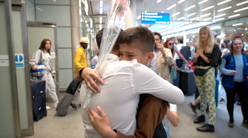 Afghan twins Irfanullah and Obaidullah Jabarkhyl, 11, are reunited at St Pancras station in London. Amy McConaghy / The National