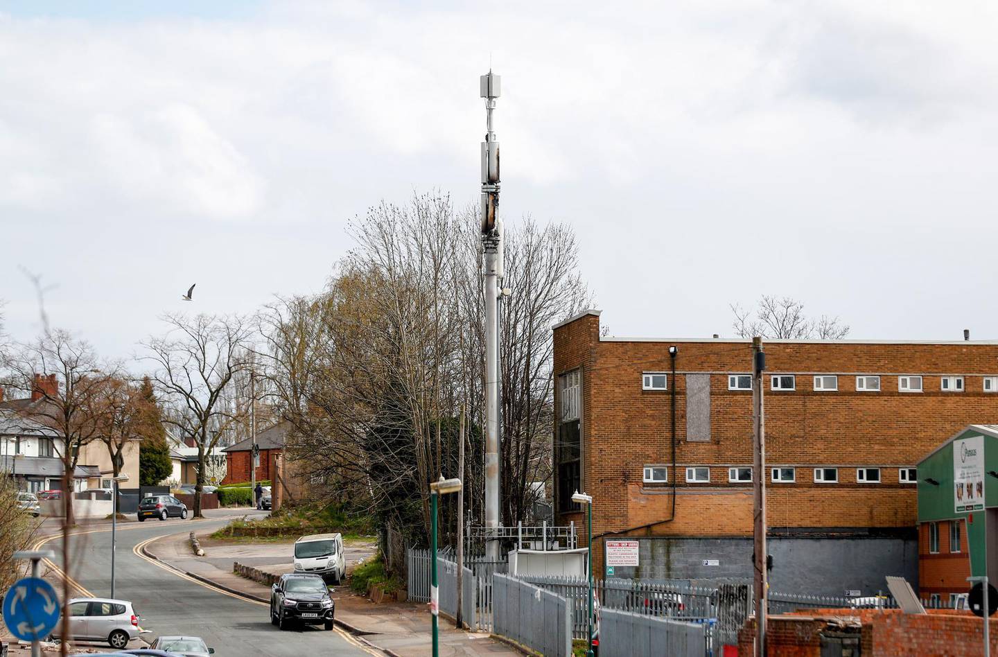 A fire-damaged telecom tower, reported in local media as being a 5G network mast on the EE network, operated by BT Group Plc, stands in Birmingham, U.K., on Monday, April 6, 2020. Telecom masts that enable the next generation of wireless communication were set on fire in the U.K. in recent days, apparently by people motivated by a theory that the tech helps spread the coronavirus. Photographer: Darren Staples/Bloomberg
