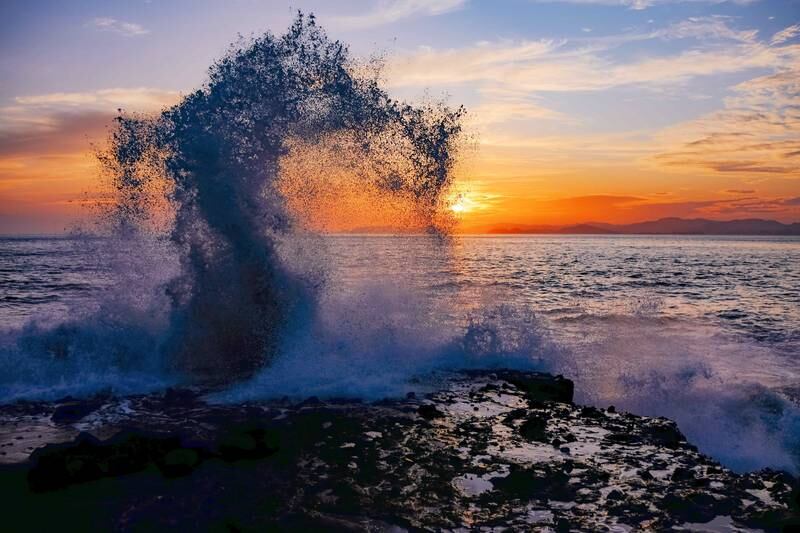Waves wash against a mangrove swamp as the sun sets in Bajamar, in Costa Rica's Puntarenas province. EPA